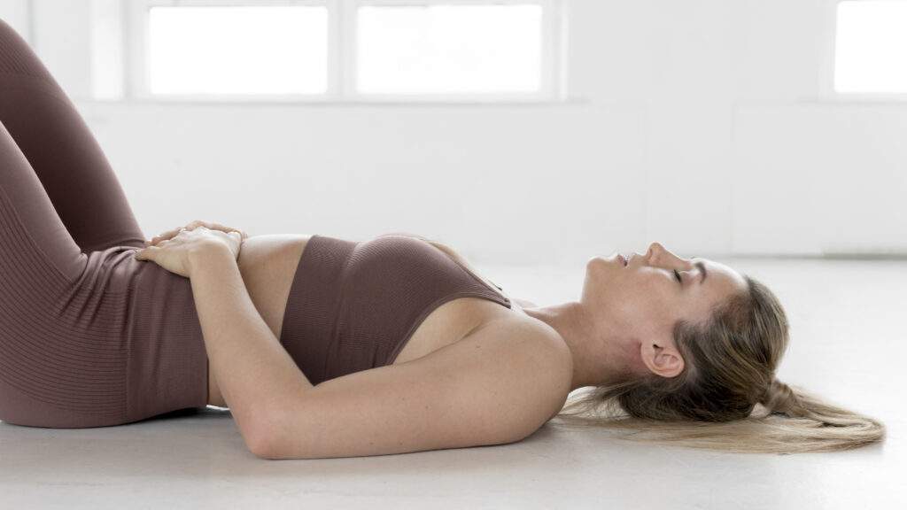 front view blonde woman laying back